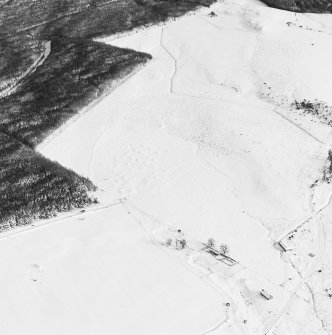 Oblique aerial view of Upperton centred on the remains of hut-circles and a field-system with the same adjacent, taken from the WSW.