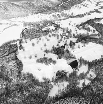 Oblique aerial view of Guisachan centred on Hilton Lodge with the remains of a country house in the background, taken from the SW.