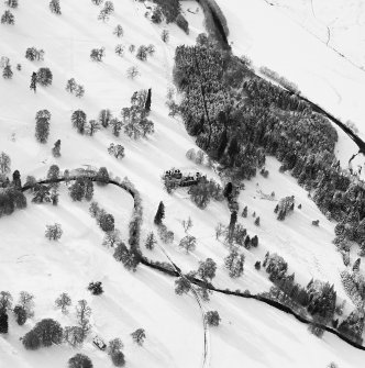 Oblique aerial view of Guisachan House centred on the remains of the country house, taken from the ENE.