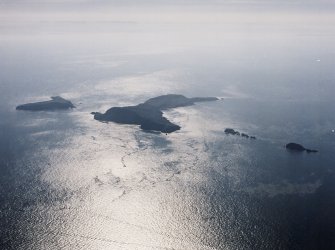 General oblique aerial view looking towards the Shiant Islands, taken from the NW.