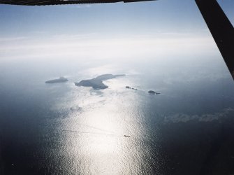 General oblique aerial view looking towards the Shiant Islands, taken from the NNW.