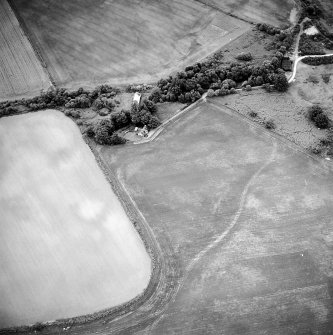 Oblique aerial view centred on the cropmarks of the possible ring-ditch with ring-ditch adjacent, taken from the S.