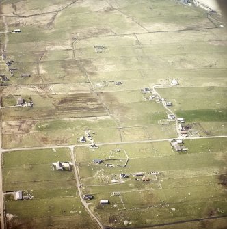 Oblique aerial view centred on the crofting township and the remains of the buildings, taken from the ENE.