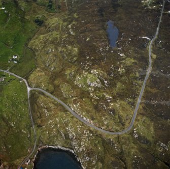 Oblique aerial view centred on the remains of the dun, taken from the SSE.