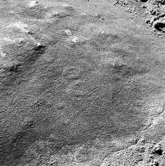 Oblique aerial view of Garbeg centred on the remains of two hut-circles in an area of small cairns and a field-system, taken from the NE.