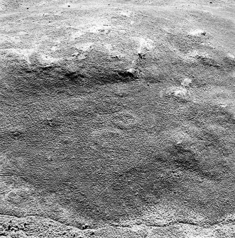 Oblique aerial view of Garbeg centred on the remains of two hut-circles in an area of small cairns and a field-system, taken from the NNW.