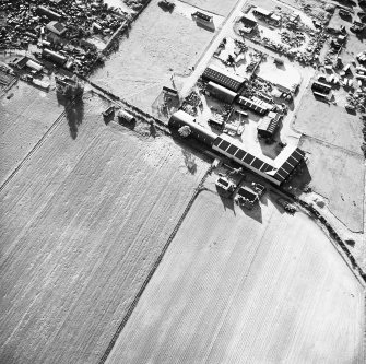 Windhill, oblique aerial view, taken from the SE, centred on the cropmarks of a ring-ditch or pit-circle.