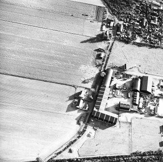 Windhill, oblique aerial view, taken from the NE, centred on the cropmarks of a ring-ditch or pit-circle.