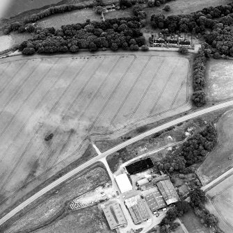 Oblique aerial view centred on the cropmarks of the possible enclosure, taken from the N.