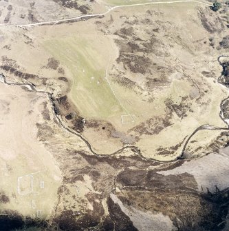 Oblique aerial view of Achad a'Chatha, taken from the WSW, centred on the remains of a township. Another township is visible in the bottom left of the photograph and a farmstead is visible in the upper centre.