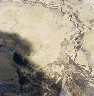 Oblique aerial view of Achad a'Chatha, taken from the S, centred on the remains of a township.