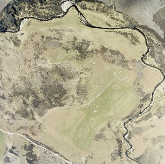 Oblique aerial view of Achad a'Chatha, taken from the N, centred on the remains of a township.