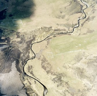 Oblique aerial view of Achad a'Chatha, taken from the SE, centred on the remains of a township. Another township is visible on the opposite bank of Raitts Burn.