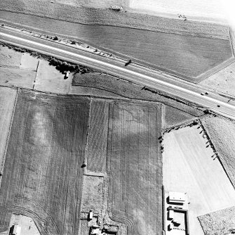 Castlehill, oblique aerial view, taken from the NE, centred on the cropmark of a possible enclosure.