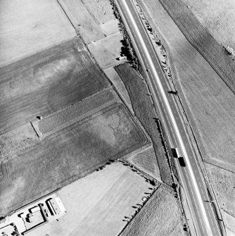 Castlehill, oblique aerial view, taken from the N, centred on the cropmark of a possible enclosure.