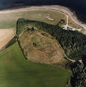 Oblique aerial view centred on the remains of the castle and the possible fort, taken from the WSW.