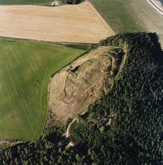 Oblique aerial view centred on the remains of the castle and the possible fort, taken from the SSW.