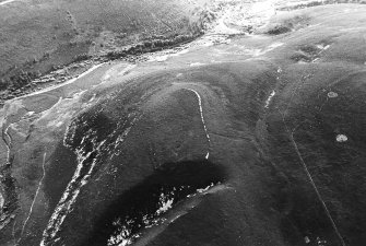 Oblique aerial view centred on the remains of the fort, taken from the ENE.