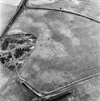 Upper Cullernie, oblique aerial view, taken from the SW, centred on the cropmark of an enclosure. A ring-ditch is visible in the top left-hand corner of the photograph.