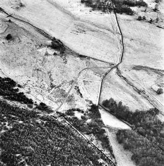 Ballourie, oblique aerial view, taken from the NNW, showing the remains of a township and rig in the left half of the photograph, and another township and an enclosure in the right half.