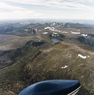 General oblique aerial view looking over Loch Etchachan and the Cairngorm mountains towards the Monadhliath mountains, taken from the ENE.