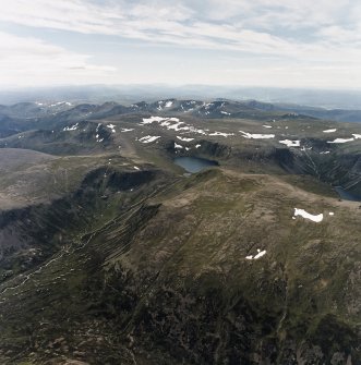 General oblique aerial view looking over Loch Etchachan and the Cairngorm mountains towards the Monadhliath mountains, taken from the ENE.