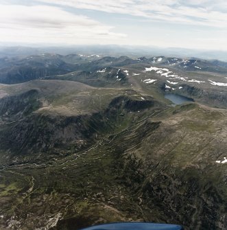 General oblique aerial view looking over Loch Etchachan and the Cairngorm mountains towards the Monadhliath mountains, taken from the ENE.