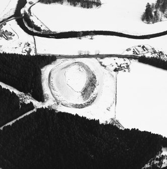 Oblique aerial view, taken from the WNW, of Doune of Invernochty Motte.