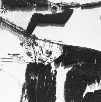Oblique aerial view of Mill of Newe centred on the water mill and house, taken from the N.