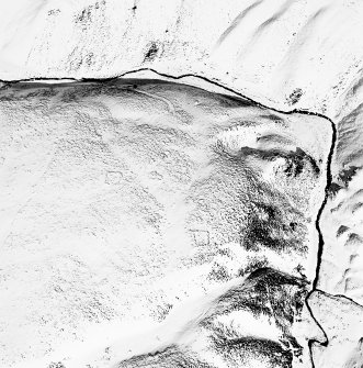 Oblique aerial view of Backie Hill centred on the remains of two enclosures, taken from the SW.