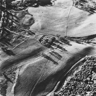 Aboyne Old Parish Church, oblique aerial view, taken from the NE, centred on the church, with the dismantled Aboyne Extension of The Deeside Railway Line visible in the top left-hand corner of the photograph.