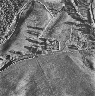 Aboyne Old Parish Church, oblique aerial view, taken from the N, centred on the church, with the dismantled Aboyne Extension of The Deeside Railway Line visible in the top right-hand corner of the photograph.