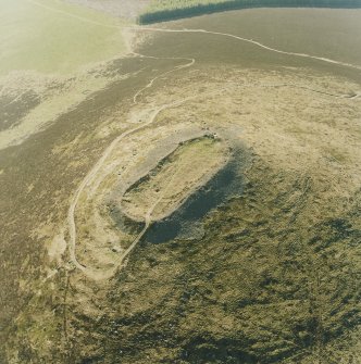 Oblique aerial view centred on the remains of the vitrified fort, taken from the E.