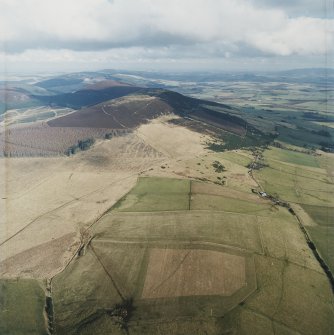 General oblique aerial view looking towards the remains of the vitrified fort, taken from the WSW.