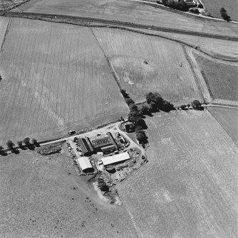 Oblique aerial view of Castle of Wardhouse centred on the cropmarks of medieval earthworks, enclosure, chapel and possible motte, taken from the NE.