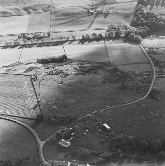 Oblique aerial view of Rosa Croft centred on the remains of cairns and field-system with small cairns and quarry adjacent, taken from the N.