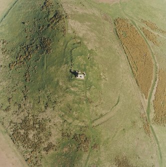 Oblique aerial view centred on the remains of the fort taken from the WNW.