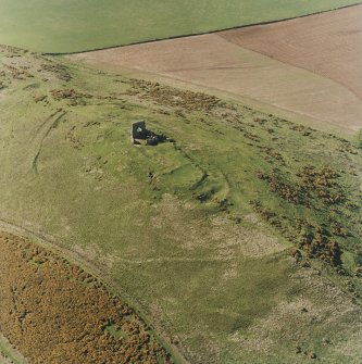 Oblique aerial view centred on the remains of the fort taken from the SE.