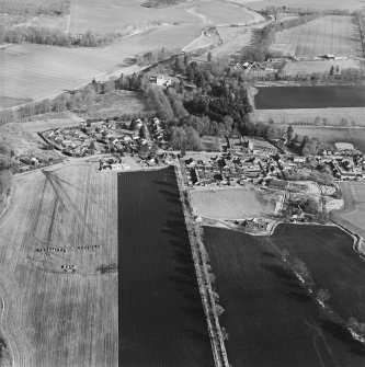 Oblique aerial view centred on the village, taken from the W.