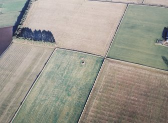 Oblique aerial view centred on the remains of the recumbent stone circle, taken from the SW.