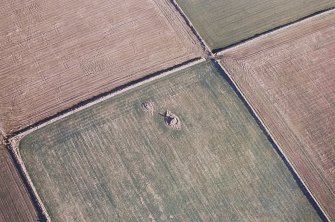 Oblique aerial view centred on the remains of the recumbent stone circle, taken from the WSW.