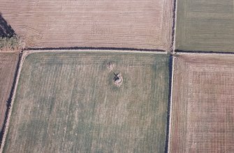 Oblique aerial view centred on the remains of the recumbent stone circle, taken from the SW.