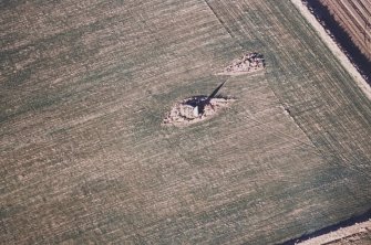 Oblique aerial view centred on the remains of the recumbent stone circle, taken from the S.