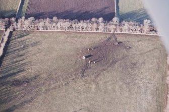 Oblique aerial view centred on the remains of the recumbent stone circle, taken from the SE.