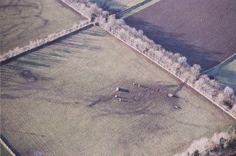 Oblique aerial view centred on the remains of the recumbent stone circle, taken from the ESE.