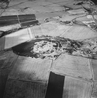 Oblique aerial view centred on the remains of the enclosure taken from the ESE.