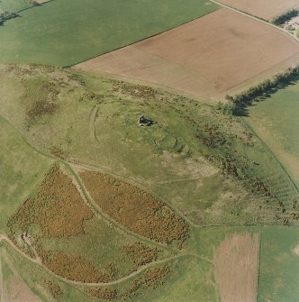 Oblique aerial view centred on the remains of the fort and rig, taken from the SSE.
