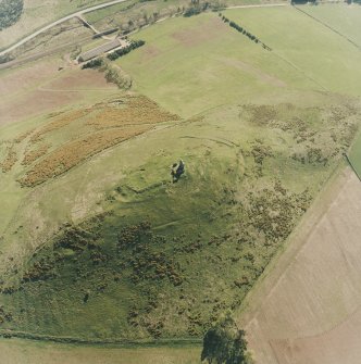 Oblique aerial view centred on the remains of the fort and rig, taken from the NE.