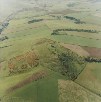 Oblique aerial view centred on the remains of the fort and rig, taken from the ESE.