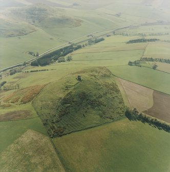 Oblique aerial view centred on the remains of the fort and rig, taken from the E.
